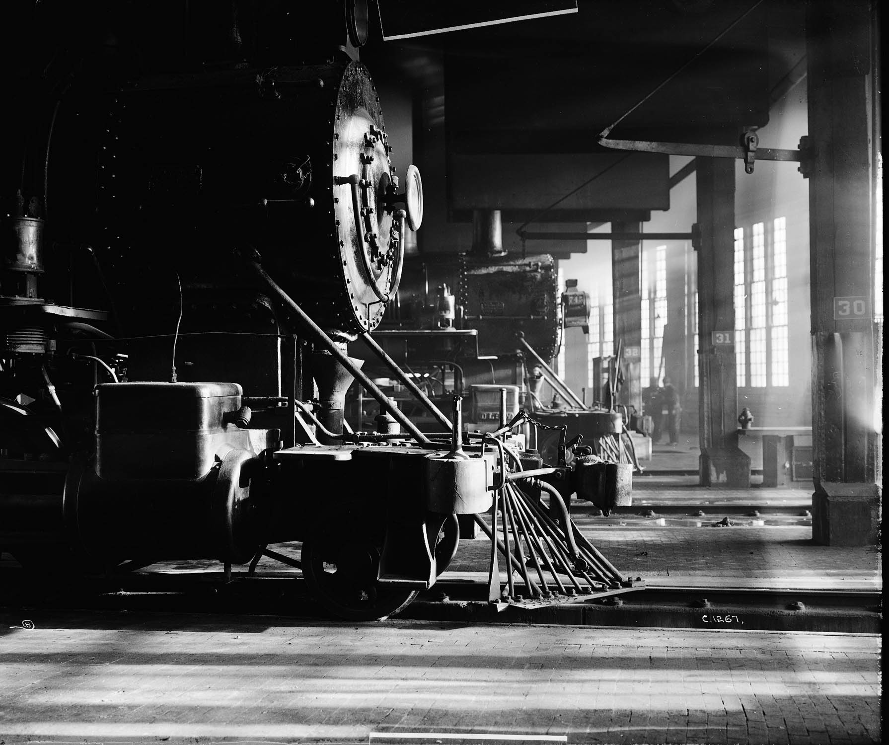 tLocomotives awaiting servicing in roundhouse